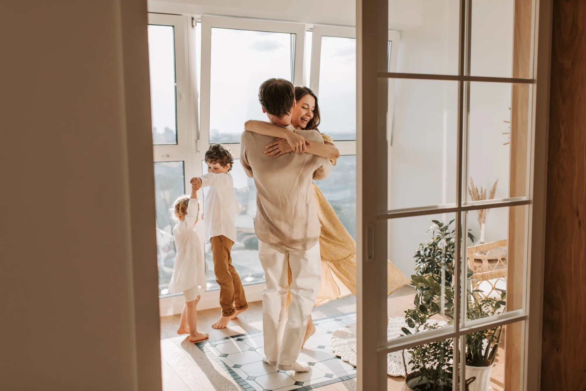 A family dancing together in their new home